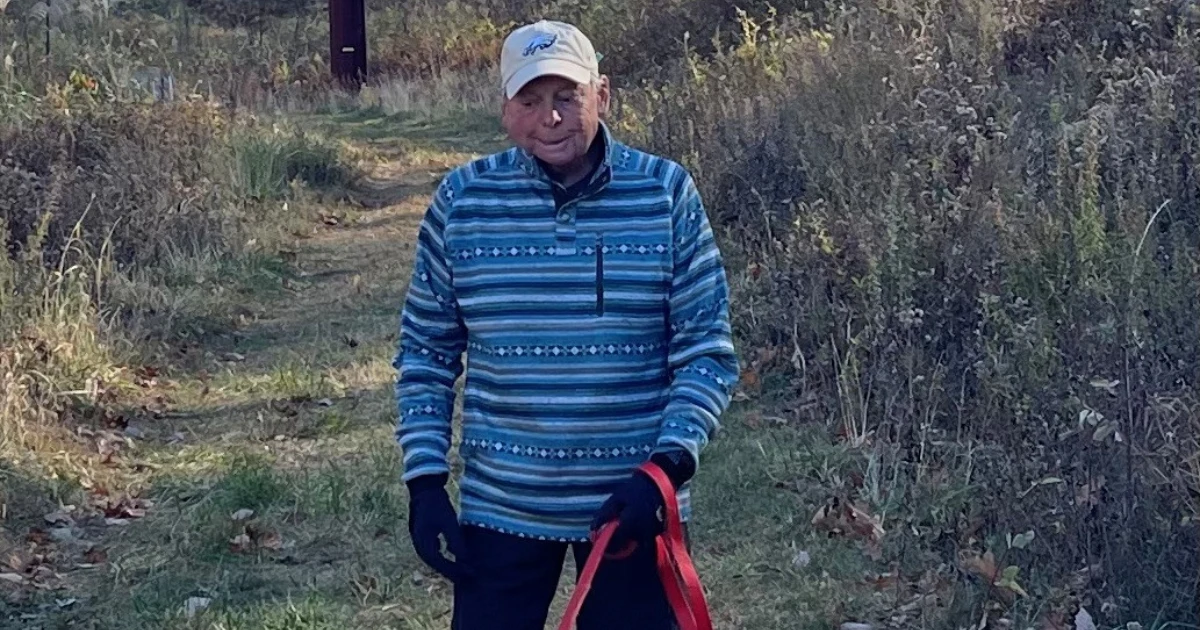 Leaf-covered, rock-strewn trail on South Mountain at the Black River Conservatory with the author and dog Luna; a humorous essay about PA’s rocks and Allentown views.