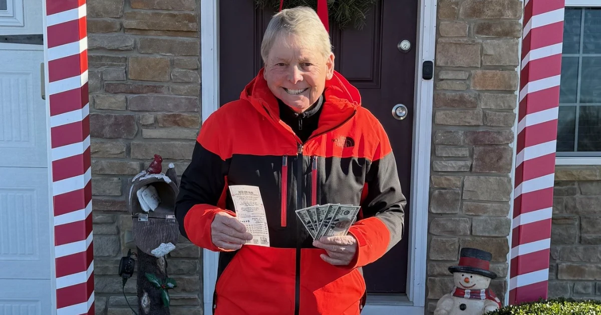 Author Richard Plinke smiling on his front porch, holding a handful of Powerball lottery tickets in winter.